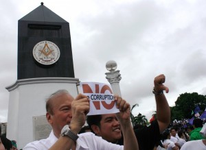 Former Senator Ramon Magsaysay Jr.,carrying a “No Corruption” placard join in the One Million March to the Rizal Park in Manila on Monday, August 26, 2013. (MNS photo)