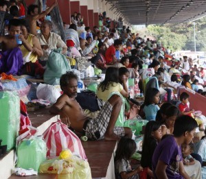 Displaced residents rest in a stadium turned into an evacuation centre in Zamboanga city in southern Philippines September 18, 2013. Police said about 80 percent of the city was retaken and rebels contained in two villages, while death toll in fighting reached 106 people and displaced around 109,000. (MNS photo)