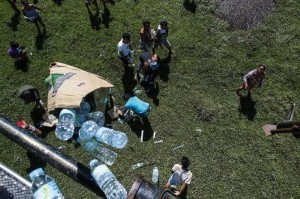A Philippine Air Forces helicopter drops relief supplies for Typhoon Haiyan survivors in Barangay San Antonio, Basey Samar November 25, 2013. Haiyan, the biggest storm ever to make landfall, struck the central Visayan islands on November 8, killing more than 5,200 people, displacing 4.4 million and destroying about 12 billion pesos in crops, property and infrastructure. (MNS photo)