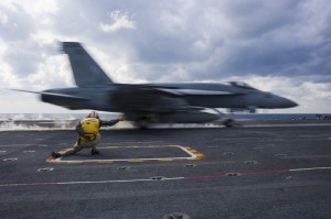 PHILIPPINE SEA (Dec. 1, 2013) Lt. Caleb McDonald, a shooter assigned to the aircraft carrier USS George Washington (CVN 73), launches an F/A-18E Super Hornet from the Eagles of Strike Fighter Squadron (VFA) 115 during the Carrier Air Wing (CVW) 5 fly-off. George Washington and its embarked air wing, CVW 5, provide a combat-ready force that protects and defends the collective maritime interest of the U.S. and its allies and partners in the Indo-Asia-Pacific region. (U.S. Navy photo by Mass Communication Specialist 3rd Class Ricardo R. Guzman/Released)