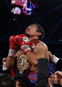 Manny Pacquiao of the Philippines celebrates his victory over Brandon Rios of the U.S. during their World Boxing Organization (WBO) International 12-round welterweight boxing title fight at the Venetian Macao hotel in Macau November 24, 2013. Pacquiao registered a decisive, unanimous decision win against American Rios to clinch the vacant WBO International welterweight title on Sunday.