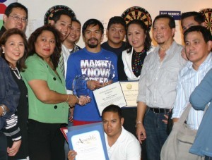 OC FIL-AM CHAMBER POWER YEAR: The Filipino American Chamber of Commerce of Orange County has lined up power events this year in the pursuit of its goals for the Fil-Am entrepreneurs and professionals in one of the most populous counties in the U.S. In this file photo are some of the officers and members after presenting the Maharlika Award to Filipino boxing champion, Manny Pacquiao, in the recent past.