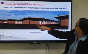 Department of public work and Highways (DPWH) OIC-Director Beth Pilorin shows the scale model for the construction of temporary shelter for families affected by super typoon 'Yolanda' in Samar and Leyte on Tuesday (November 26, 2013) at the DWPH head office in Port Area, Manila. DPWH Secretary Rogelio Singson said works are on-going for the construction of bunkhouse units in 4 sites in Tacloban City, Palo (Leyte), and Basey and Marabut towns in Samar. (MNS photo)