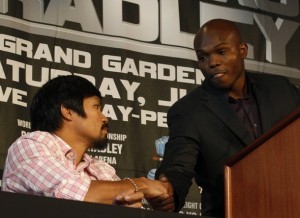 Undefeated junior welterweight champion Manny "Pacman" Pacquiao of the Philippines (L) greets Timothy "Desert Storm" Bradley Jr. of the U.S. during a news conference in New York February 23, 2012. Pacquiao will fight Bradley for the world championship on June 9, 2012 in Las Vegas, Nevada. REUTERS/Brendan McDermid (UNITED STATES - Tags: SPORT BOXING)