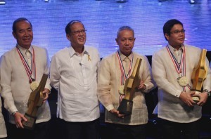 President Benigno S. Aquino III shares the stage with the 2013 The Outstanding Filipino (TOFIL) awardees Public Works and Highways Secretary Rogelio Singson for Governance and Public Service; DOST Forester Arsenio Ella for Environmental Conservation and Sustainable Development; and Dr. Alfredo Mahar Francisco Lagmay for Geology and Earth Science, for a group photo souvenir during the Awarding Ceremonies at the Insular Life Auditorium, Insular Life Corporate Center, Filinvest Corporate City in Alabang, Muntinlupa City on Wednesday (January 29, 2014). The TOFIL Award is a project of Junior Chamber International (JCI) Senate Philippines and the Insular Life Assurance Co., Limited. Having recognized outstanding Filipinos for more than two decades, TOFIL has become an institution, having developed a reputation for its selectiveness of outstanding men and women upon whom the award is conferred. It seeks to give national recognition to Filipinos whose selfless dedication to their profession or vocation has resulted in significant contributions to the welfare of their countrymen and our country at large, as well as to the advancement of their respective fields of endeavor. (Photo by Rey Baniquet / Malacañang Photo Bureau / PCOO)