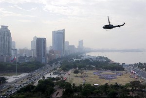 A helicopter hovers above a large human women symbol at the Quirino Grandstand on the celebration International Women's Day in Manila, the Philippines, 08 March 2014. According to the Philippine Commission on Women, more than 10,000 participants join the human formation to set a new Guinness World Record as the 'Biggest human formation on women's symbol'. (MNS photo)