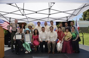 Various chairs of the Organizing Philippine Independence Day Committee and dignitaries are pictured seated from left: Actor Dante Basco, Ann Cuatrona, Gloria O. Pulido, Mayor Mark E. Pulido, Consul General Leo M. Herrera-Lim, Cerritos Commissioner Doris Iglesias, Cerritos Let Freedom Ring Committee Member Melette E. Lampino and Pangasinan Brotherhood-USA Board Secretary Rhenee M. Ferrer. Standing from left: Cerritos Sheriff Station Captain Keith Swensson, Marissa Pulido-Rebaya, Toni Skiles, Bellflower Mayor Sonny Santa Ines, ABC School Board Member Armin Reyes, Carson Mayor Protem Elito Santarina, Artesia Councilman and former Mayor Victor Manalo, Artesia Councilman Ali Taj and journalist Dan E. Nino.