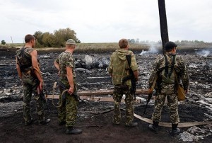 Armed pro-Russia separatists secure the site where the ill-fated Malaysia Airlines Boeing 777 flight MH17 crashed near Grabovo in Donetsk, Ukraine on Thursday, July 17. All 298 people aboard were killed in the crash, which sharply raised the stakes in a conflict between Kiev and pro-Moscow rebels. Reuters/Maxim Zmeyev