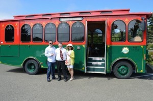 Jannelle and Lester pose by the vintage trolley, with Jeffrey Beared of the MTA, who drove and accompanied guests on their tour of Mendocino Coast, specifically designed by the couple.
